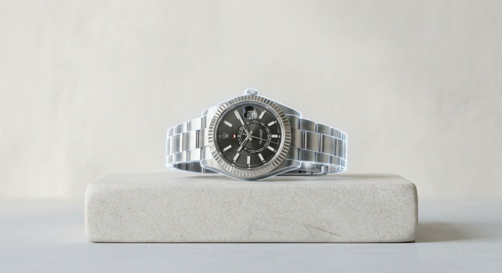A watch on a stone plinth under a 3D scan wireframe